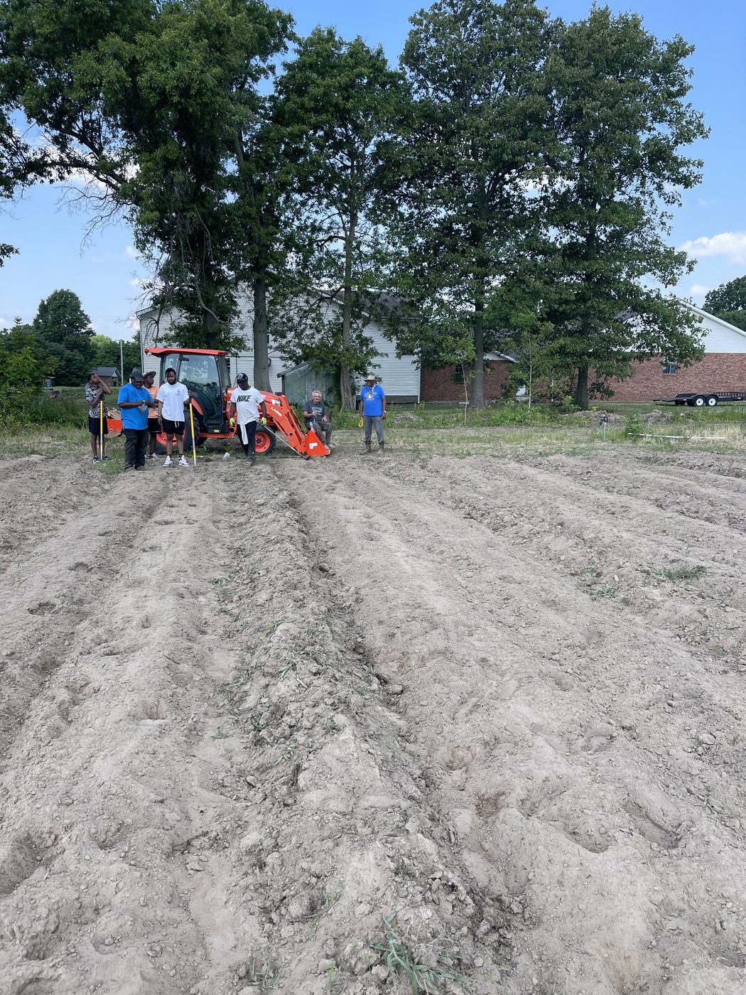 Community members breaking ground on the Faith Temple Complex community garden