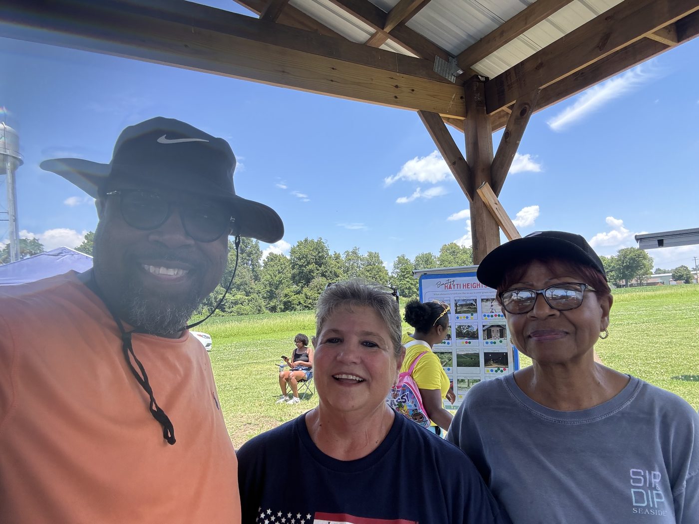 Pastor and community members at STAN's Market event