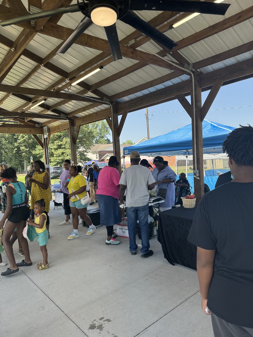 Community members shopping at STAN's Market