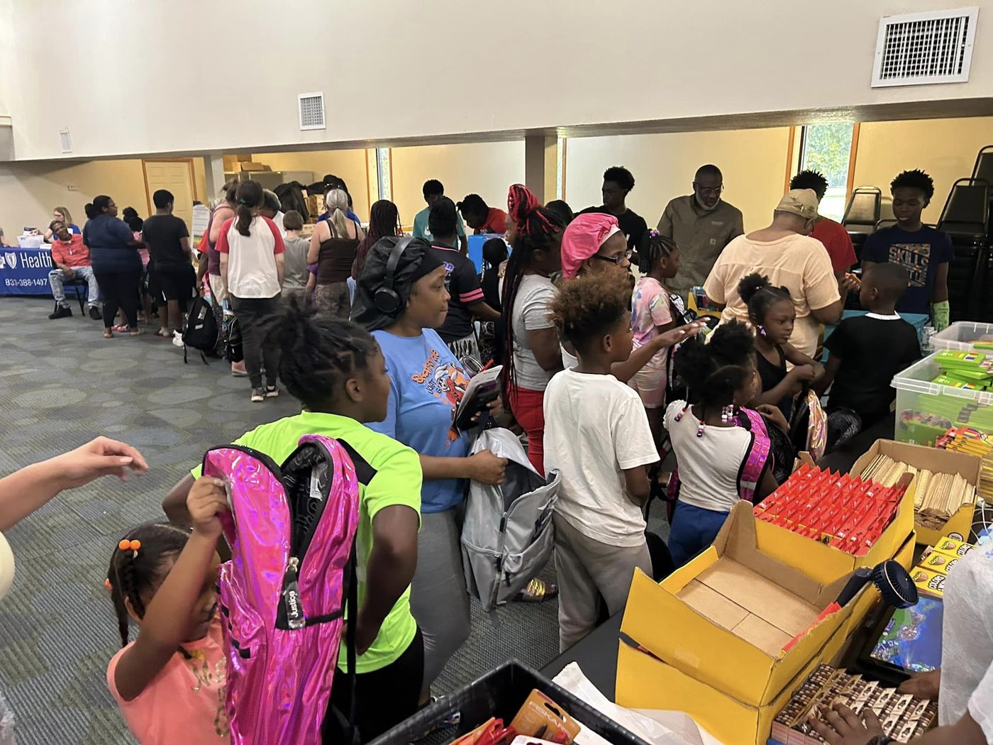 Community members at the back-to-school supplies distribution