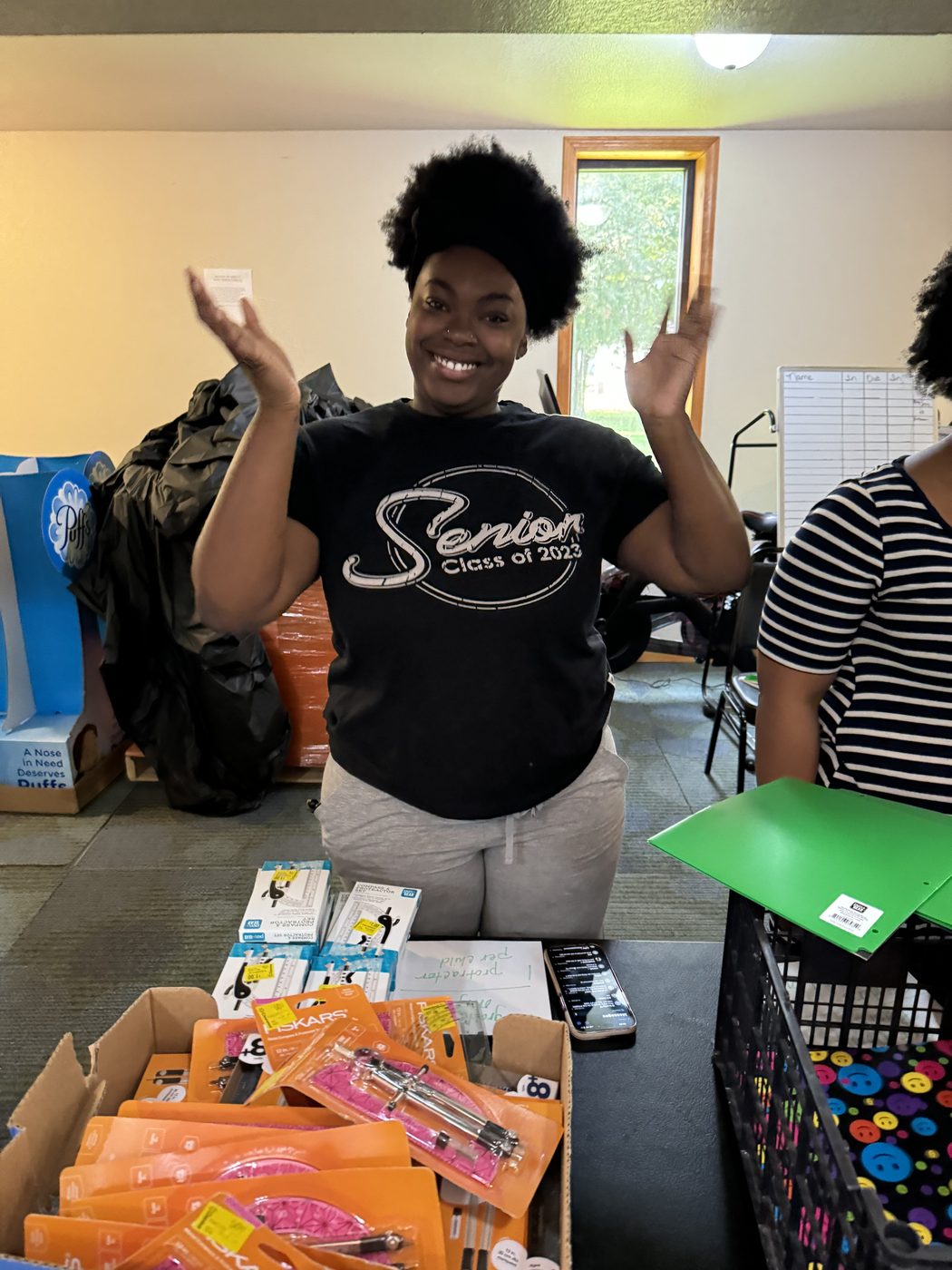 Volunteer with school supplies